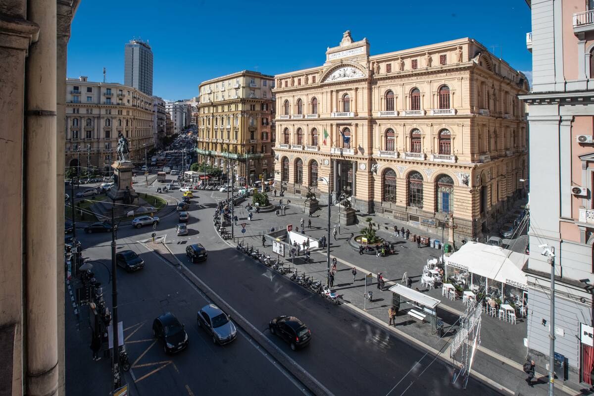 A historic building with classical architecture, a central plaza, and surrounding urban streets.