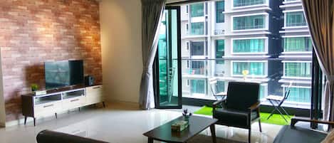 Condo, 3 Bedrooms | Living room | Flat-screen TV