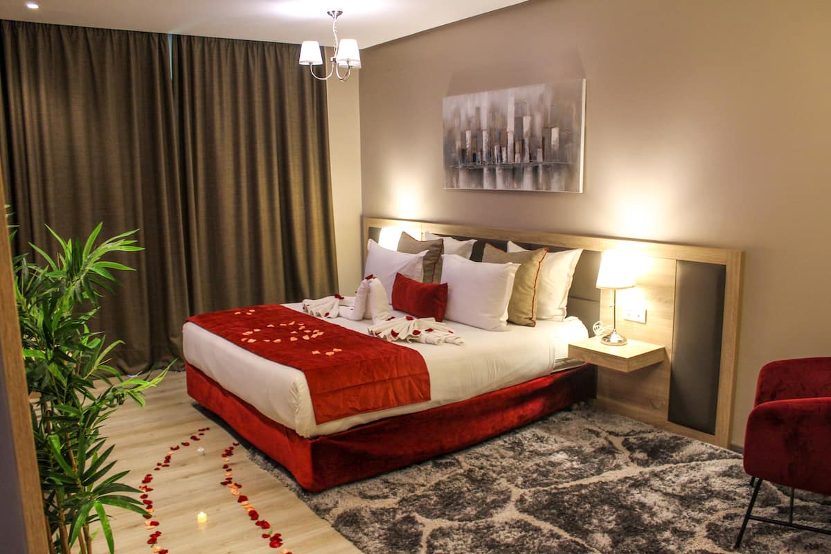 Deluxe Suite, 1 Bedroom, Non Smoking, Terrace | Down comforters, individually decorated, laptop workspace