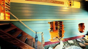 A mural of a ship's deck with a sign reading "TAVERN DEL CAPITANO". - Taverna del Capitano (Massa Lubrense)