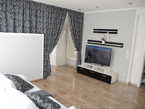 Apartment, 1 King Bed with Sofa bed, Non Smoking (Apartment 2) | Living area | Flat-screen TV - Merkel Villa Apartamente (Wiesbaden)