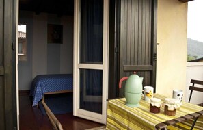 Comfort Triple Room, Garden View | Balcony