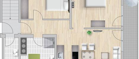 A hotel room layout with a bed, seating area, kitchenette, and bathroom.