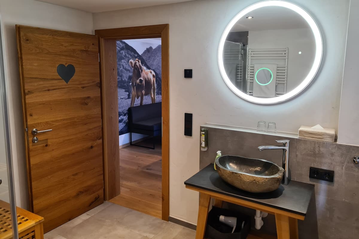 Designer toiletries, hair dryer, heated floors, toilet paper