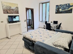 Family Apartment, 3 Bedrooms, Balcony, City View | Living area | Flat-screen TV