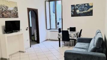 Family Apartment, 3 Bedrooms, Balcony, City View | Living area | Flat-screen TV