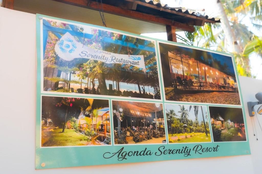 A framed collage of a restaurant with outdoor seating, a sign reading 'Agonda Serenity Restaurant,' and the name 'Agonda Serenity Resort' at the bottom.