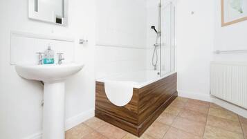 Combined shower/bathtub, hair dryer, towels, soap