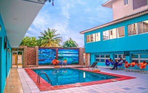 Outdoor pool, pool umbrellas, sun loungers