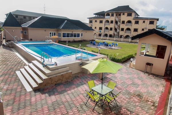 Outdoor pool, pool umbrellas, sun loungers