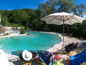 Seasonal outdoor pool, pool umbrellas, pool loungers