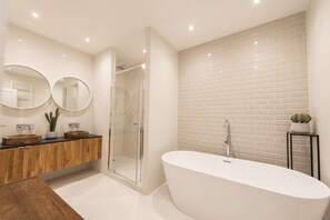 Bathtub, hair dryer, towels