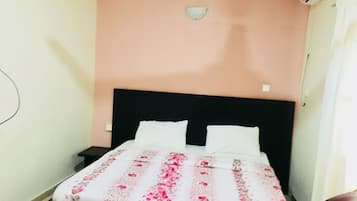 Desk, blackout curtains, bed sheets