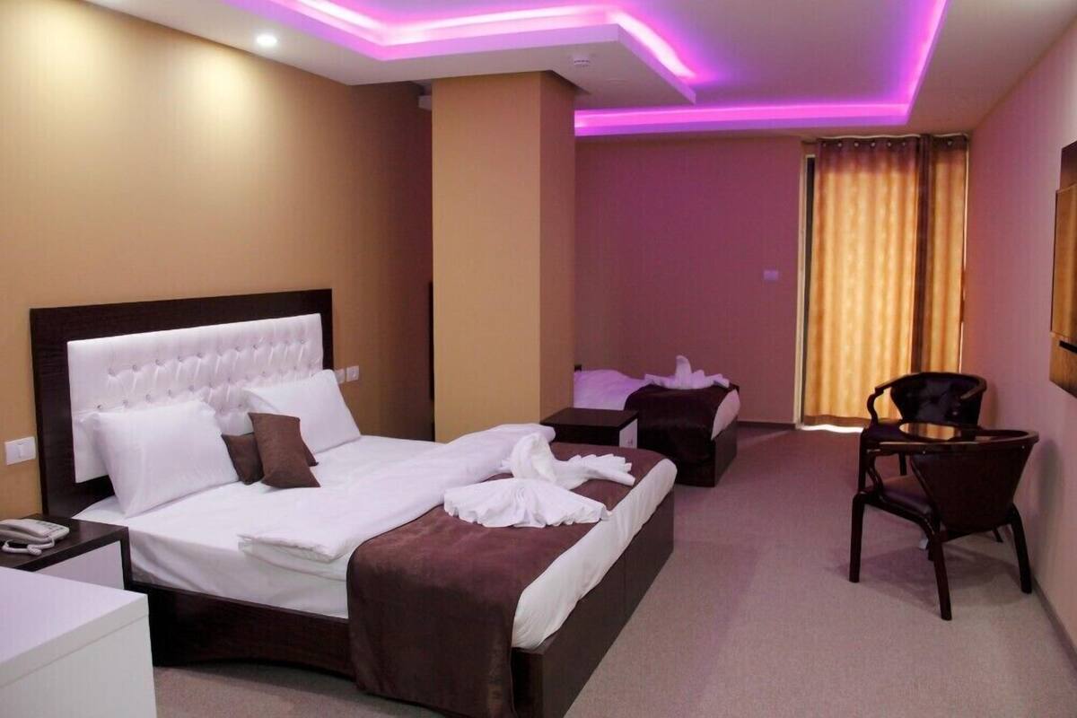 Deluxe Triple Room, Multiple Beds, Non Smoking | 3 bedrooms, minibar (free items), in-room safe, desk