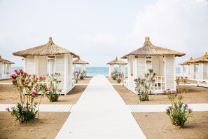 On the beach, sun-loungers, beach umbrellas, beach towels