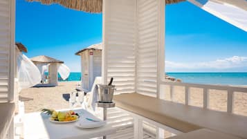 On the beach, sun loungers, beach umbrellas, beach towels