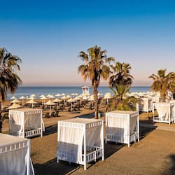 On the beach, sun loungers, beach umbrellas, beach towels