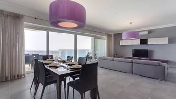 Apartment, 3 Bedrooms | Living area | 50-inch Smart TV with cable channels, TV