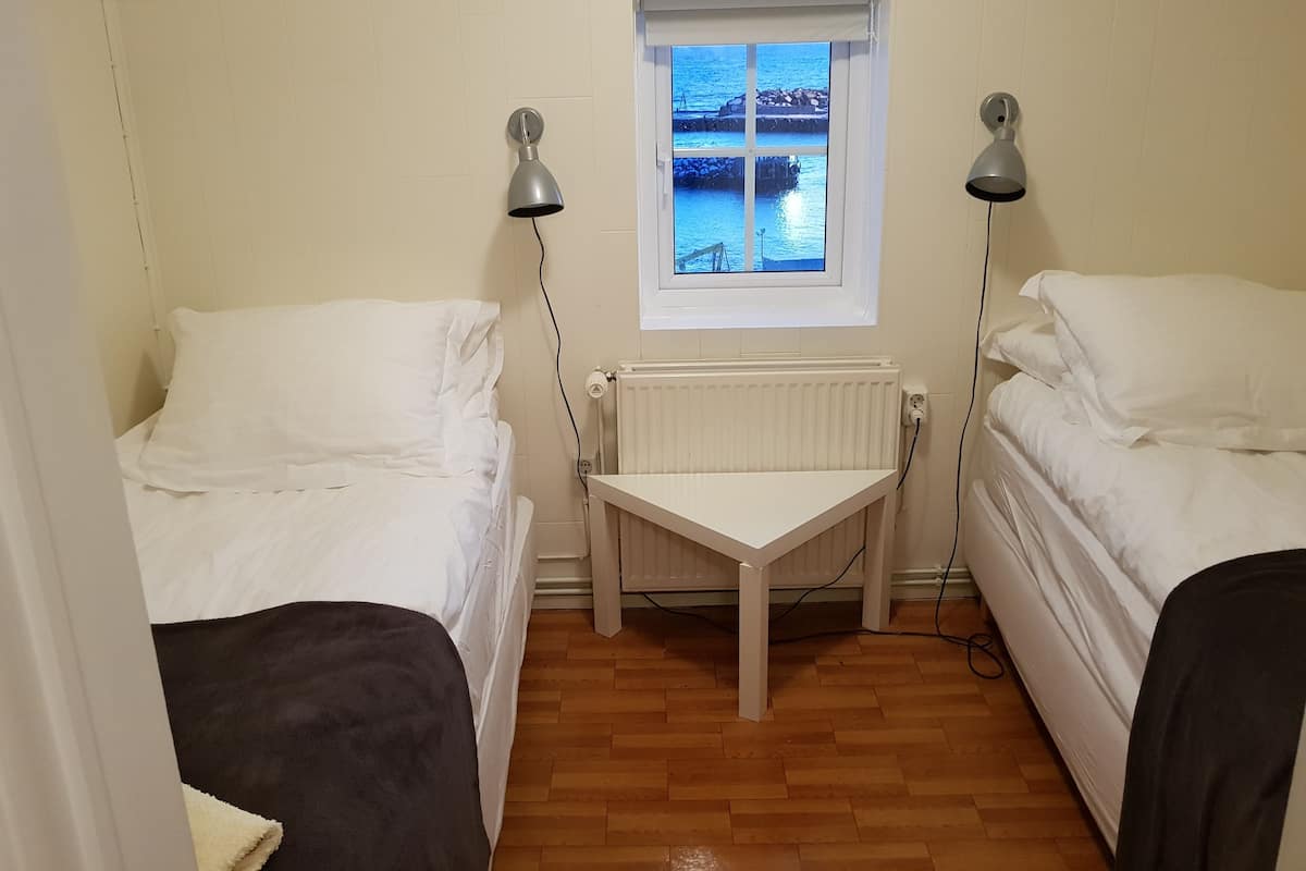 Twin Room, Shared Bathroom | Blackout drapes, cribs (free), WiFi (free), bed sheets