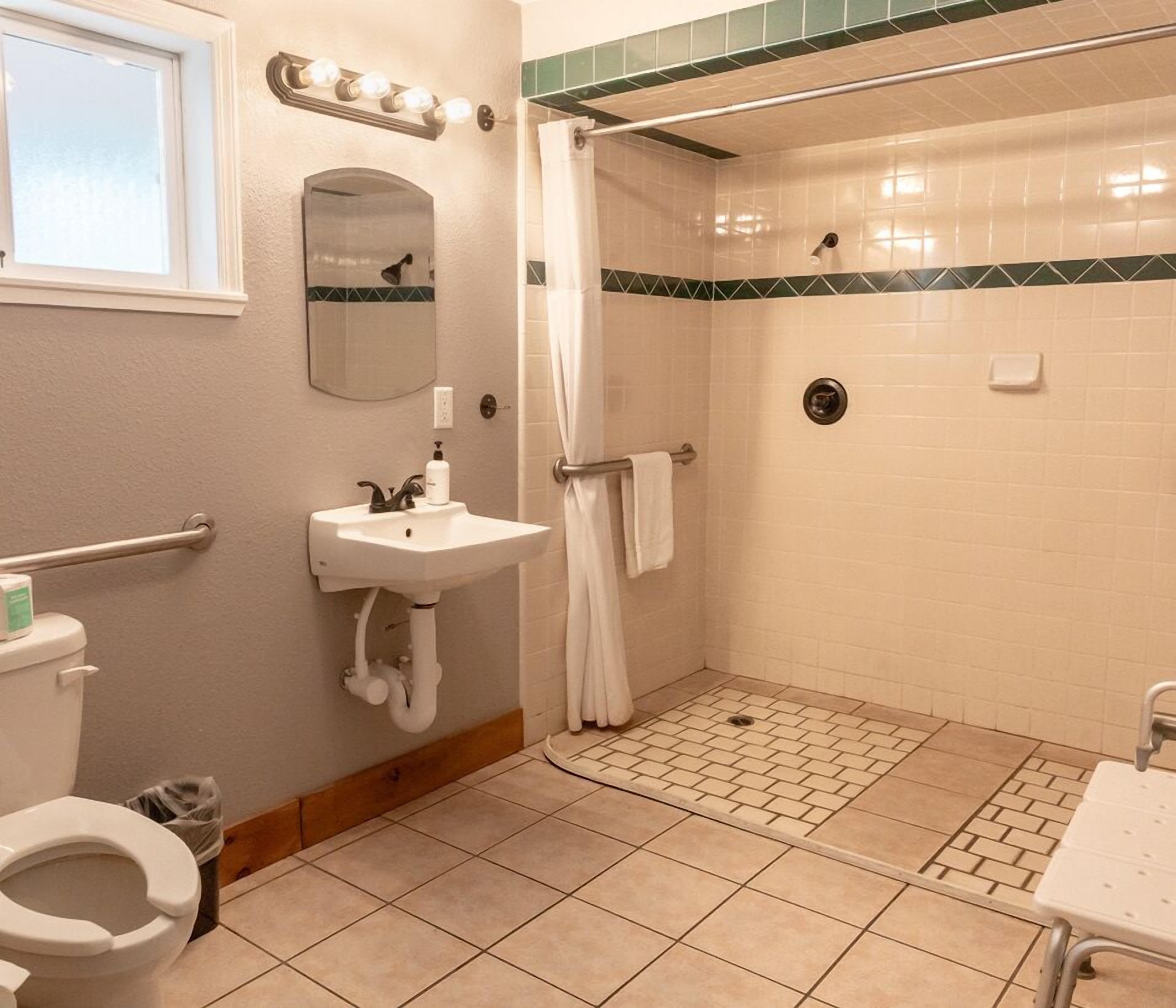 ada camp site | bathroom | combined shower/bathtub, eco-friendly toiletries, towels, soap