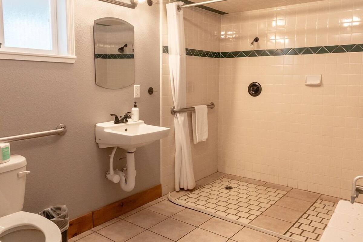 ada camp site | bathroom | combined shower/bathtub, eco-friendly toiletries, towels, soap