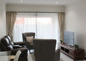 Comfort Condo, Multiple Beds, Non Smoking, Garden View | Living room | 48-inch Smart TV with premium TV channels, TV - Martinone's (Sandton)