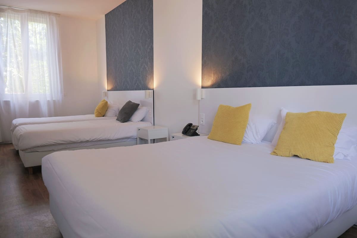 Family Quadruple Room | In-room safe, individually decorated, individually furnished, desk