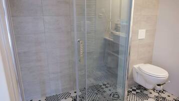 Shower, free toiletries, hair dryer, towels