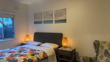 1 bedroom, desk, iron/ironing board, travel crib