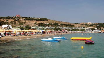 On the beach, sun loungers