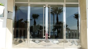 A building entrance with a glass door labeled "VELIMAR II". - Enchanting apartment, 1st beach line, panoramic views, parking, fast internet (Almuñécar)