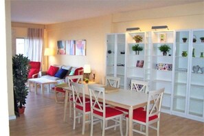 Cozy living room with a dining table and comfortable seating area.