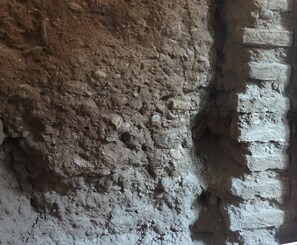 A rough, textured wall with a brick pattern. - Sun Studio @ Valencia - Excellent - with Balcony :) City Center (Valencia)