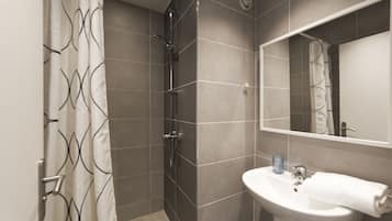 Bathtub, hair dryer, towels, soap