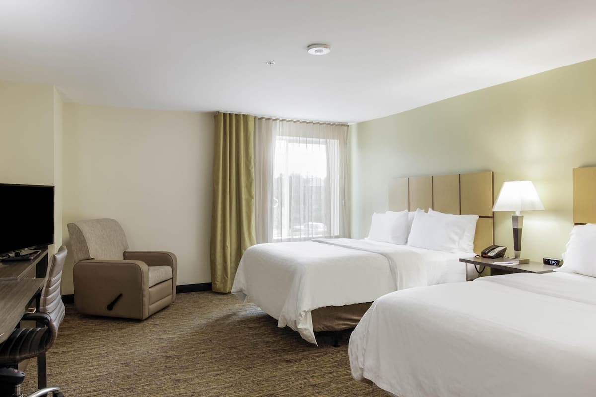 Premium bedding, pillow-top beds, desk, blackout curtains