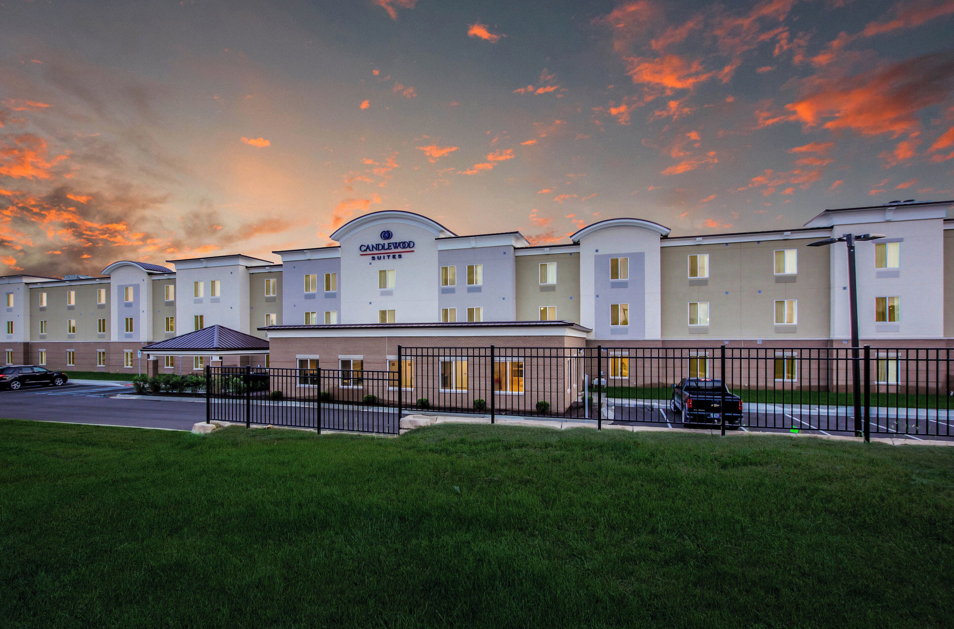 A hotel with a modern design, featuring a series of connected buildings with a flat roof and a prominent entrance.