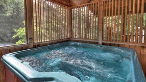 A hot tub with wooden railings and a view of trees. - Lovesong #9- Charming & Clean Log Cabin!! (Sevierville)