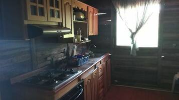 Cabin, 4 Bedrooms | Private kitchen | Full-sized fridge, stovetop, cookware/dishes/utensils