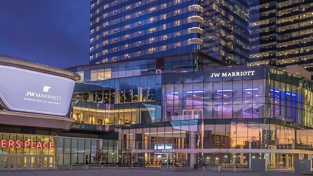 JW Marriott Edmonton Ice District building with glass facade and illuminated signage.