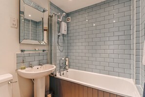 Combined shower/tub, hair dryer, towels, soap