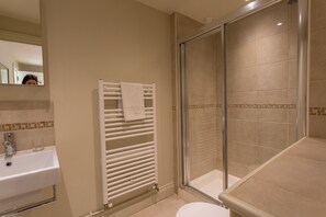 Bathtub, hair dryer, towels, soap