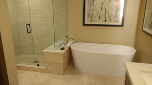 Bathtub, hair dryer, towels, soap