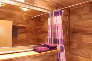Bathtub, hair dryer, towels, soap