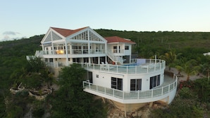 A multi-story house with a pool, surrounded by lush greenery. - The Most Beautiful and Relaxing Oceanfront Views of Curacao (Santa Martha)
