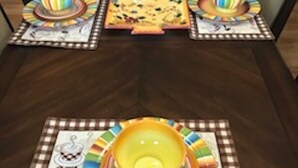 A dining table with a placemat featuring a cafe design, surrounded by chairs. - A small piece of South Carolina Heaven (Myrtle Beach)
