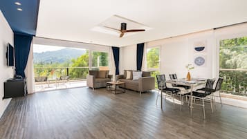 Grand Suite, 2 Bedrooms | Living area | 49-inch Smart TV with cable channels, TV