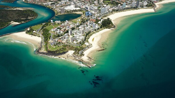 An aerial view of a coastal city with a beach, dense urban area, and a marina. - Allamanda Court Unit 6 neat and tidy unit handy to Tweed Heads Bowls Club (Tweed Heads)