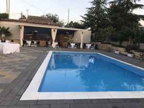 Seasonal outdoor pool, pool umbrellas, pool loungers