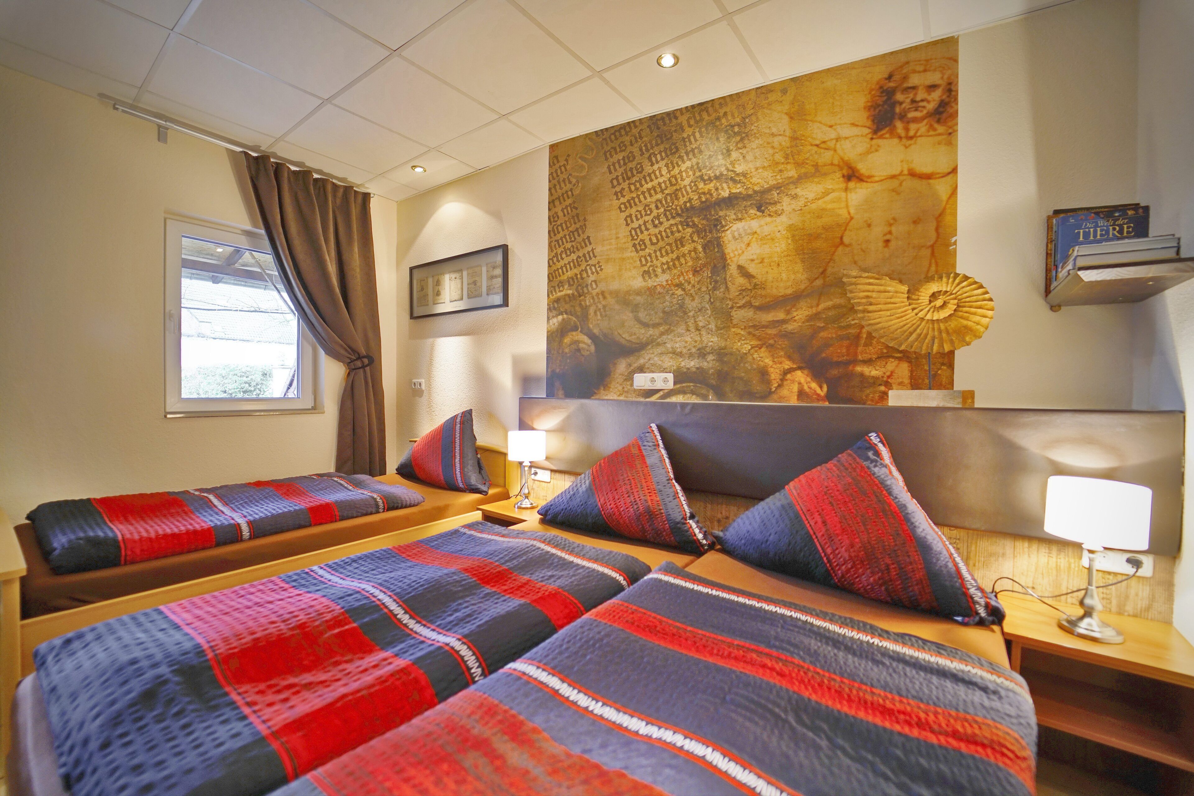 comfort triple room, 3 single beds, accessible, garden view | desk, laptop workspace, blackout curtains, soundproofing