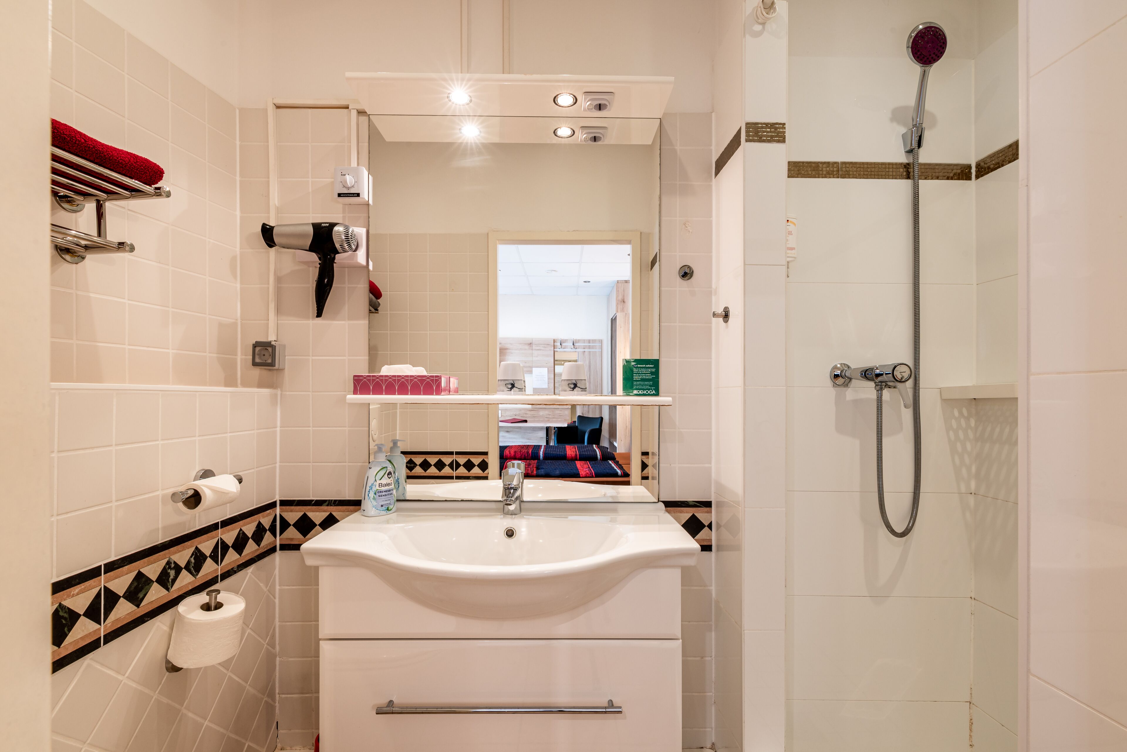 comfort triple room, 3 single beds, accessible, garden view | bathroom | shower, hair dryer, towels